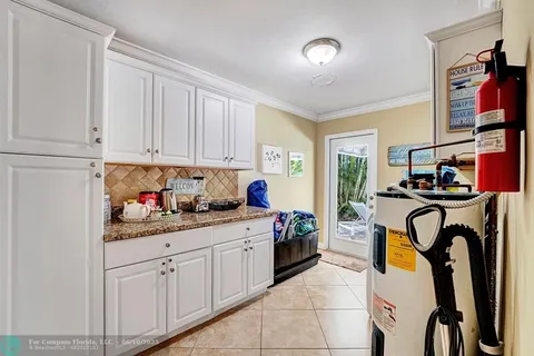 a kitchen with stainless steel appliances granite countertop a refrigerator and a stove