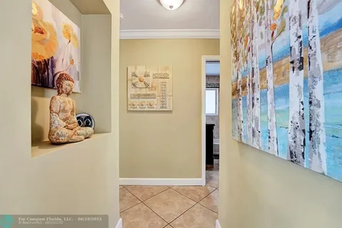a view of a bathroom with a shower and a mirror