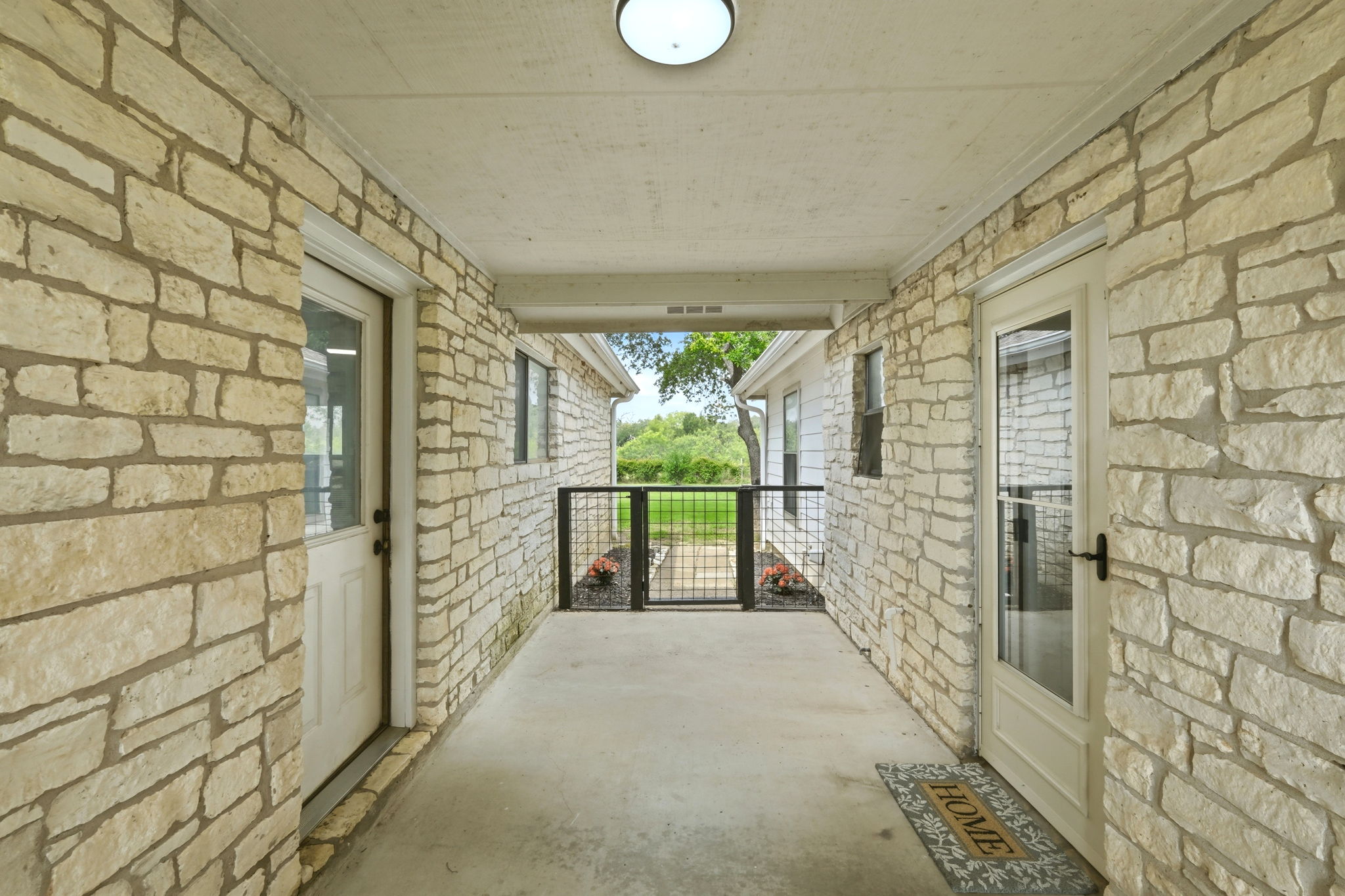 900 County Road 474 Elgin, TX 78621 - Photo 24 of 36 Covered Breezeway between Garage and House