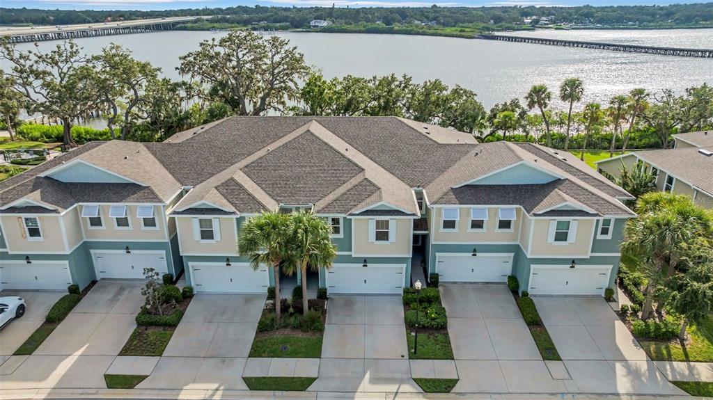4007 Palm Key Avenue Oldsmar, FL 34677 - Photo 1 of 30 a aerial view of a house with a yard and balcony