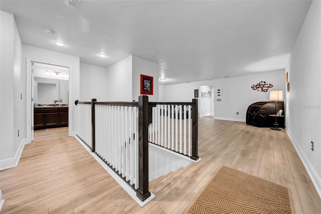 4007 Palm Key Avenue Oldsmar, FL 34677 - Photo 11 of 30 a view of a bedroom with wooden floor and windows
