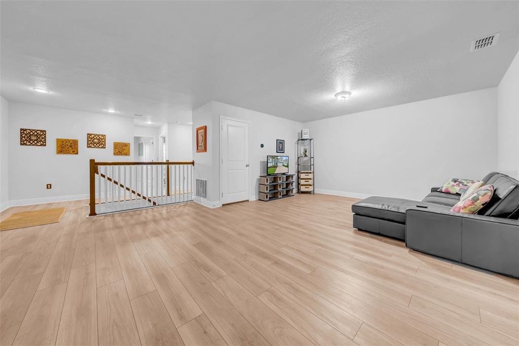 4007 Palm Key Avenue Oldsmar, FL 34677 - Photo 13 of 30 a view of a livingroom with furniture and wooden floor
