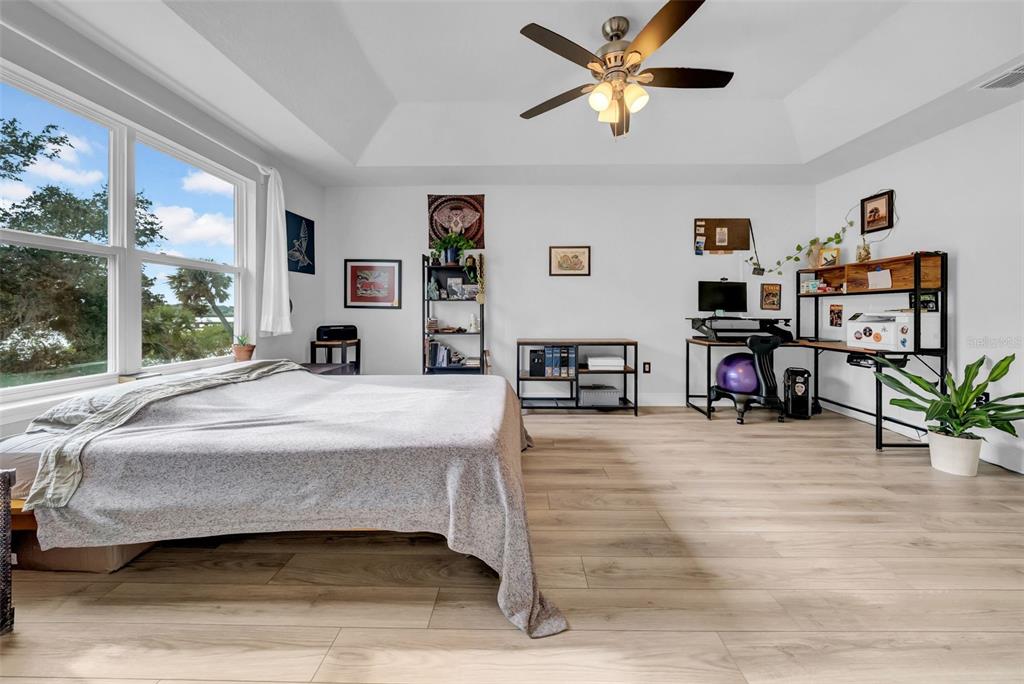 4007 Palm Key Avenue Oldsmar, FL 34677 - Photo 18 of 30 a bedroom with a bed and a large window