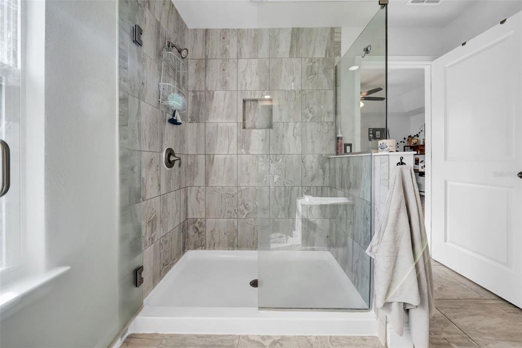 4007 Palm Key Avenue Oldsmar, FL 34677 - Photo 20 of 30 a bathroom with a tub and a shower