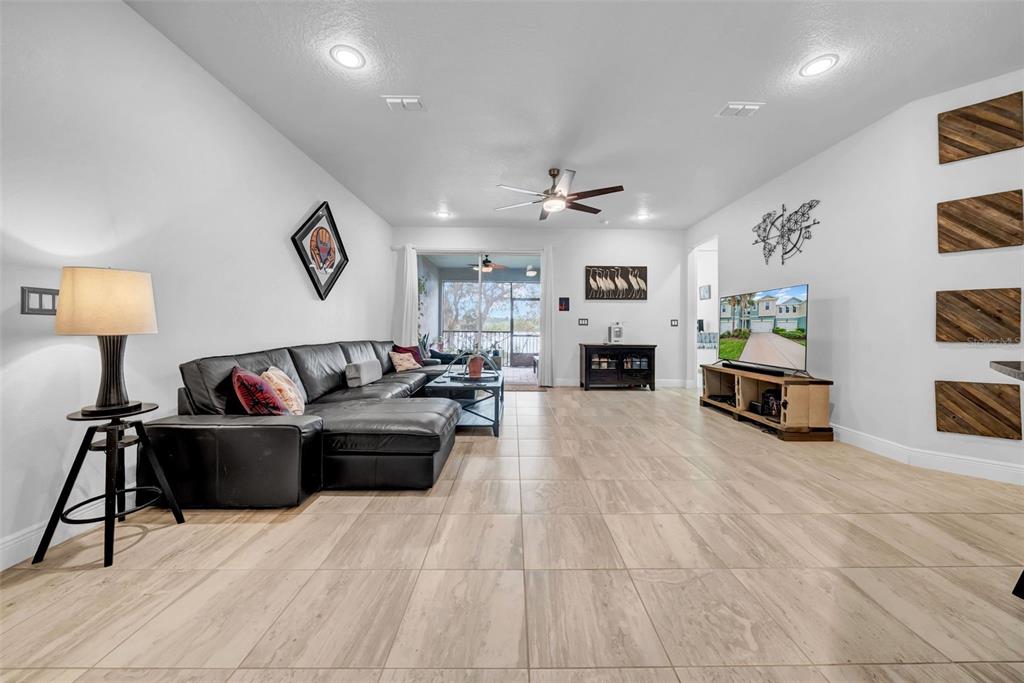 4007 Palm Key Avenue Oldsmar, FL 34677 - Photo 2 of 30 a living room with furniture and a fireplace