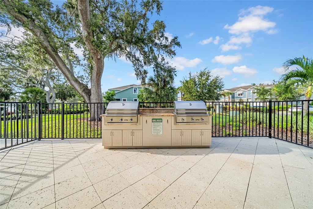 4007 Palm Key Avenue Oldsmar, FL 34677 - Photo 23 of 30 a view of a pathway with a wrought fence