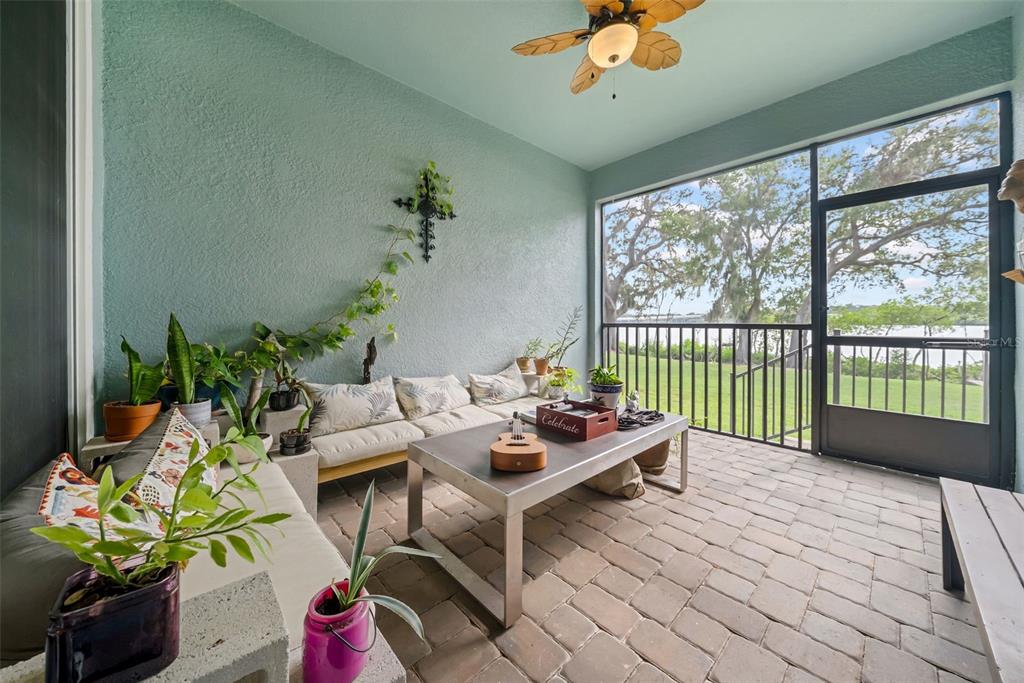 4007 Palm Key Avenue Oldsmar, FL 34677 - Photo 30 of 30 a living room filled with furniture and a potted plant