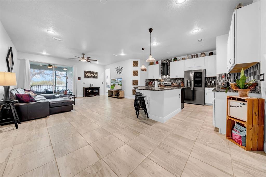 4007 Palm Key Avenue Oldsmar, FL 34677 - Photo 3 of 30 a large white kitchen with lots of counter top space and appliances