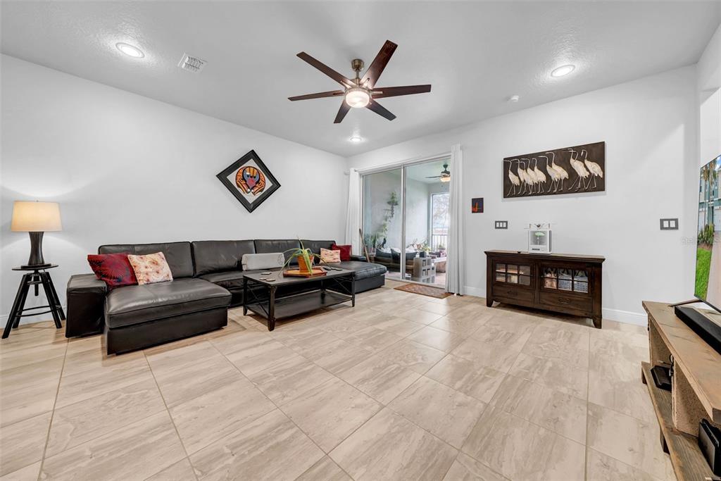 4007 Palm Key Avenue Oldsmar, FL 34677 - Photo 5 of 30 a living room with furniture and a fireplace