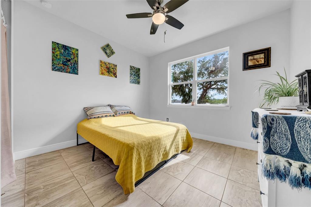 4007 Palm Key Avenue Oldsmar, FL 34677 - Photo 9 of 30 a spacious bedroom with a bed and a window