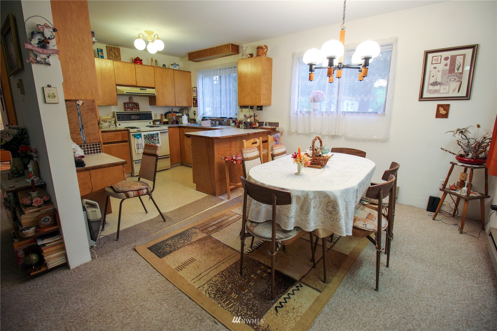 8014 Valley View Road Custer, WA 98240 - Photo 5 of 28 a view of a dining room with furniture and a chandelier