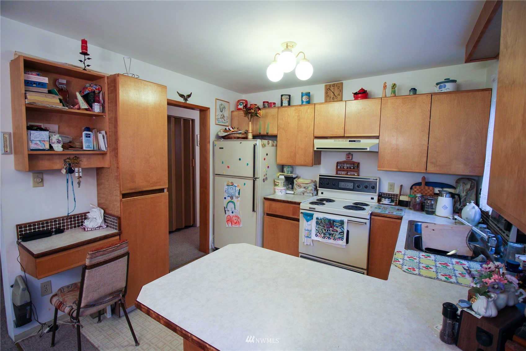 8014 Valley View Road Custer, WA 98240 - Photo 6 of 28 a kitchen with stainless steel appliances a stove a refrigerator a sink dishwasher and a dining table with the view of kitchen