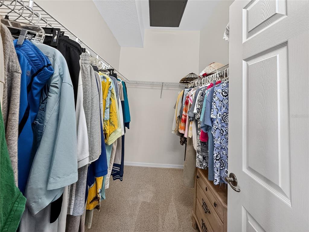 920 Spring Park Street, Unit 303 Celebration, FL 34747 - Photo 21 of 40 a view of walk in closet with clothes