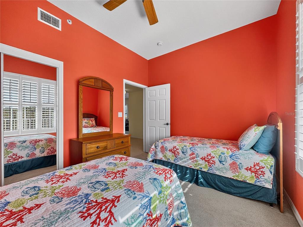 920 Spring Park Street, Unit 303 Celebration, FL 34747 - Photo 23 of 40 a bedroom with a bed and wooden floor