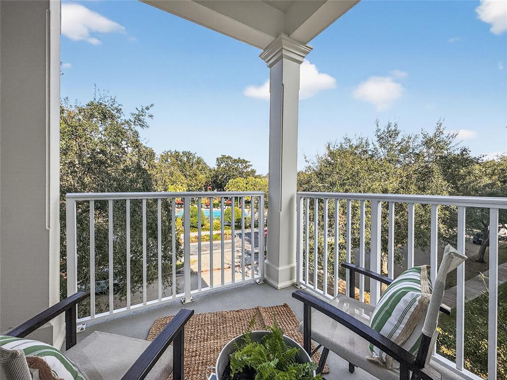 920 Spring Park Street, Unit 303 Celebration, FL 34747 - Photo 3 of 40 a view of a balcony with furniture