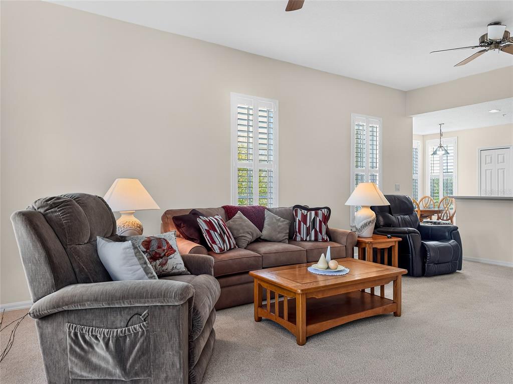 920 Spring Park Street, Unit 303 Celebration, FL 34747 - Photo 8 of 40 a living room with furniture