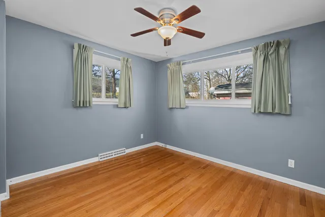 a view of room with window and ceiling fan