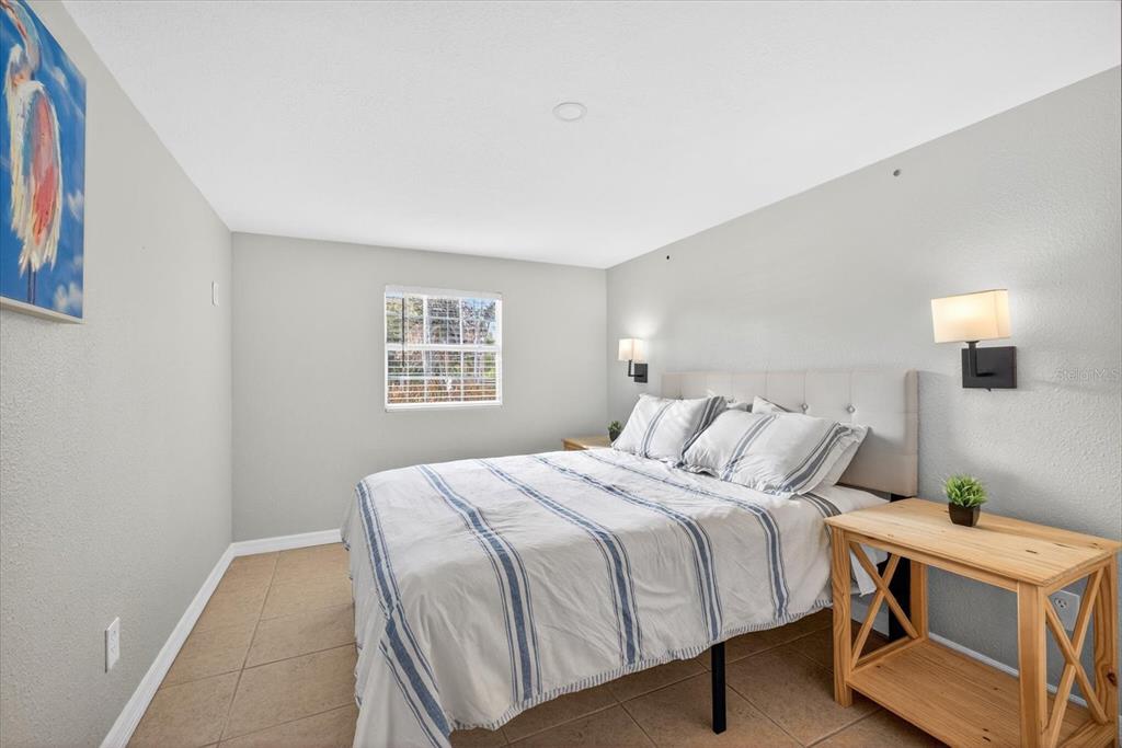 7286 Aberdeen Court Weeki Wachee, FL 34607 - Photo 12 of 37 a bedroom with a bed and a window