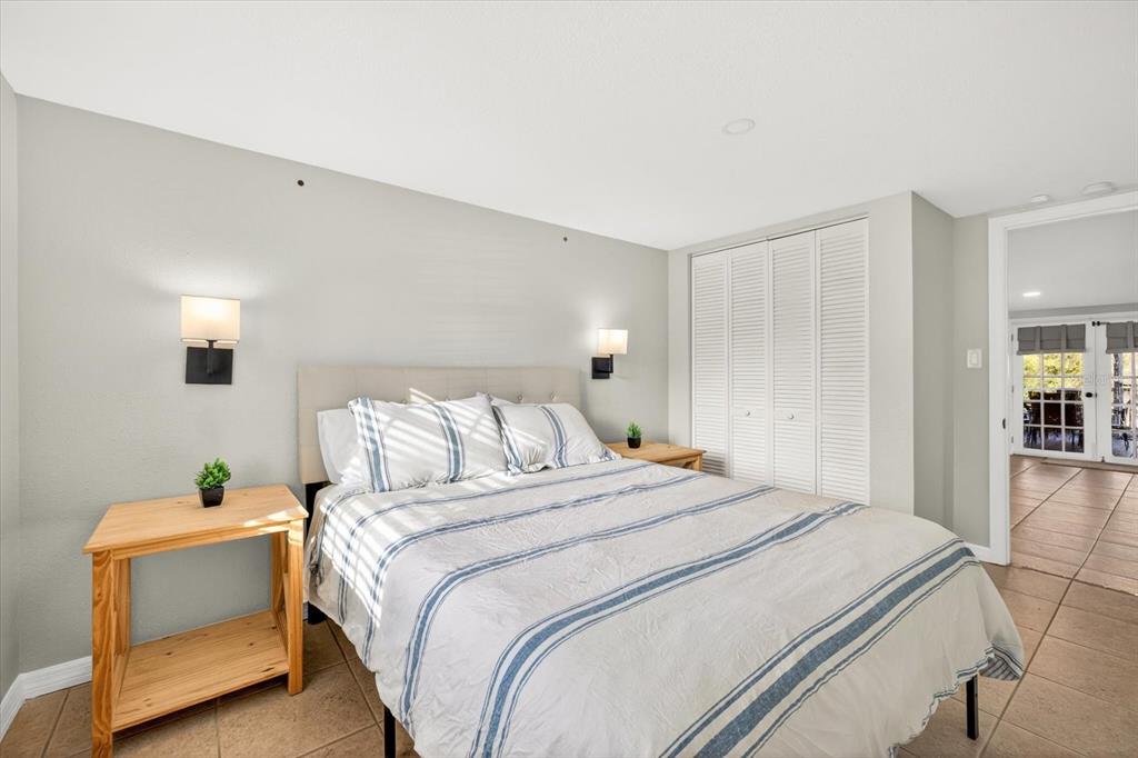 7286 Aberdeen Court Weeki Wachee, FL 34607 - Photo 13 of 37 a bedroom with a bed and a potted plant