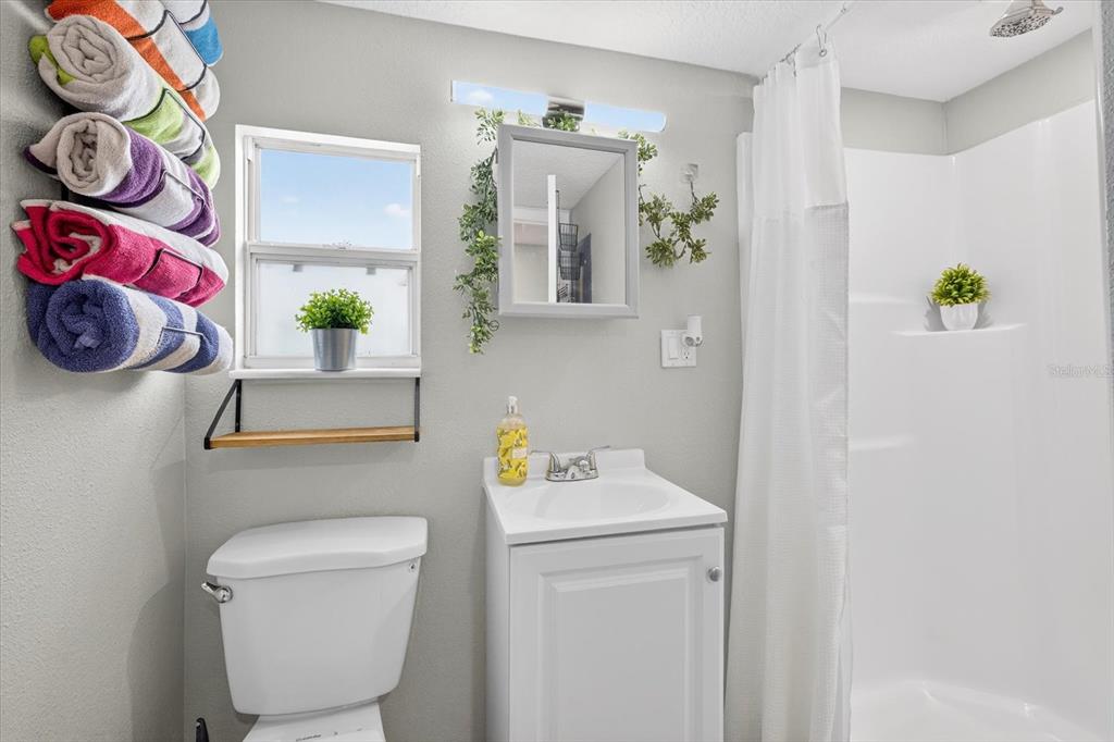 7286 Aberdeen Court Weeki Wachee, FL 34607 - Photo 14 of 37 a bathroom with a toilet and a sink