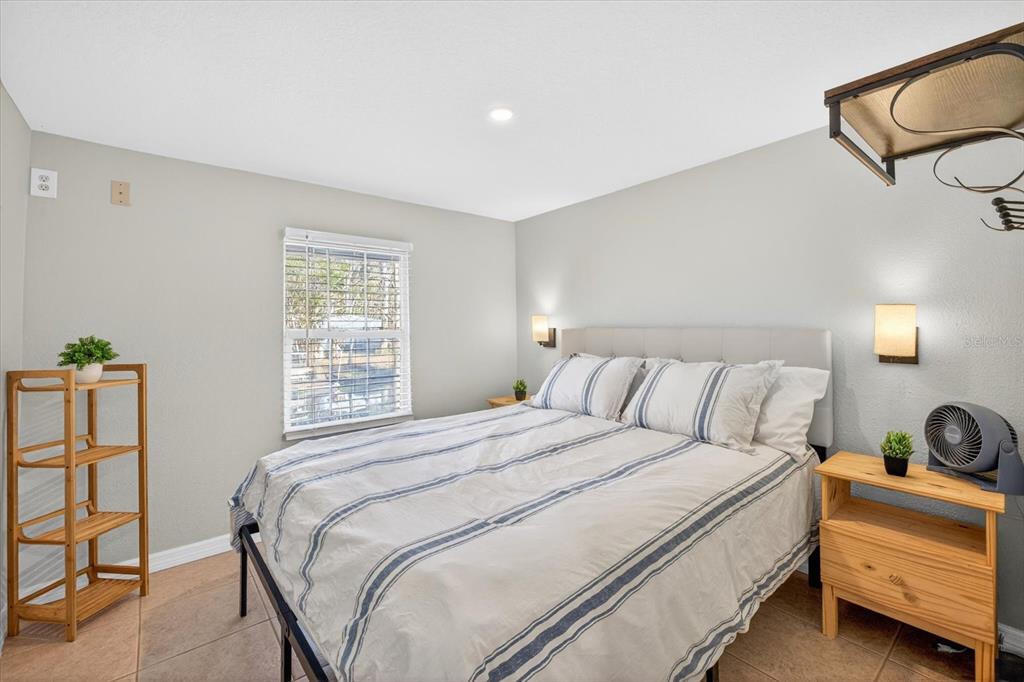 7286 Aberdeen Court Weeki Wachee, FL 34607 - Photo 18 of 37 a bedroom with a bed and a window