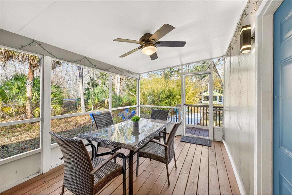7286 Aberdeen Court Weeki Wachee, FL 34607 - Photo 19 of 37 a view of a dining room with furniture window and wooden floor