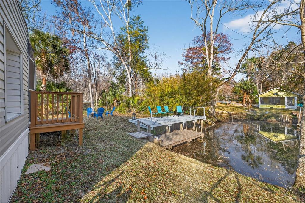 7286 Aberdeen Court Weeki Wachee, FL 34607 - Photo 22 of 37 a view of a yard with plants and trees