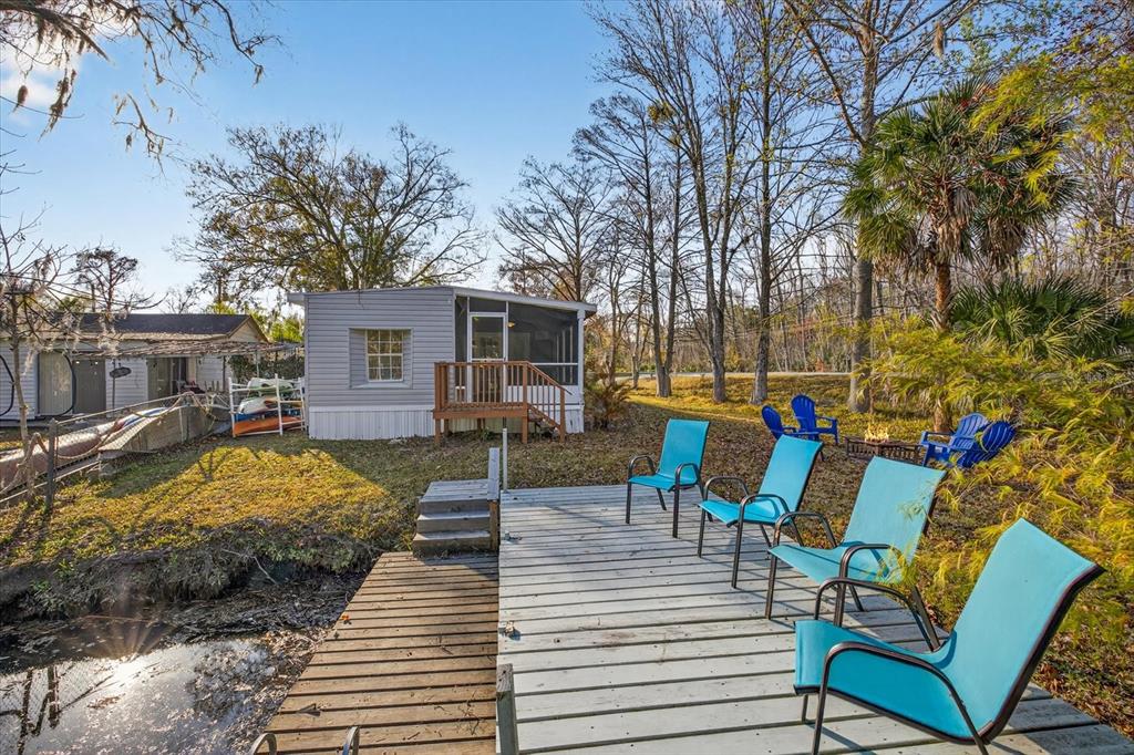 7286 Aberdeen Court Weeki Wachee, FL 34607 - Photo 25 of 37 a view of a house with backyard and sitting area