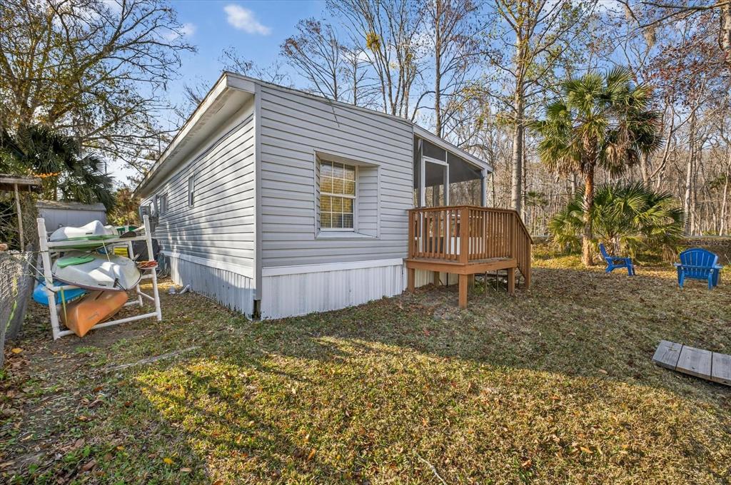 7286 Aberdeen Court Weeki Wachee, FL 34607 - Photo 27 of 37 a view of a house with a yard and wooden fence