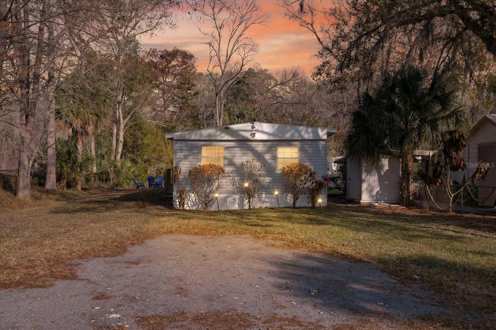 7286 Aberdeen Court Weeki Wachee, FL 34607 - Photo 31 of 37 a view of outdoor space with trees