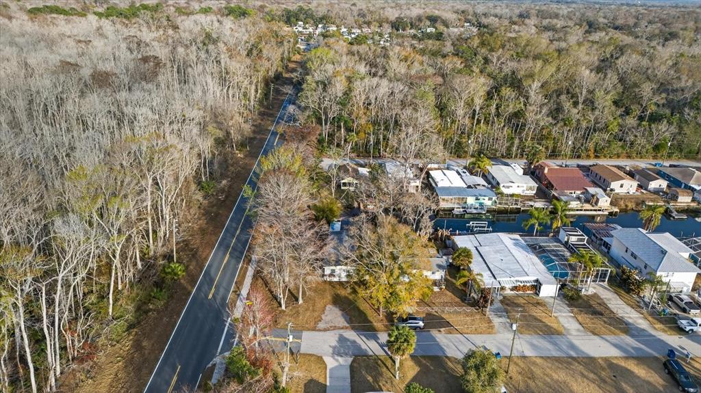 7286 Aberdeen Court Weeki Wachee, FL 34607 - Photo 34 of 37 an aerial view of residential houses with yard