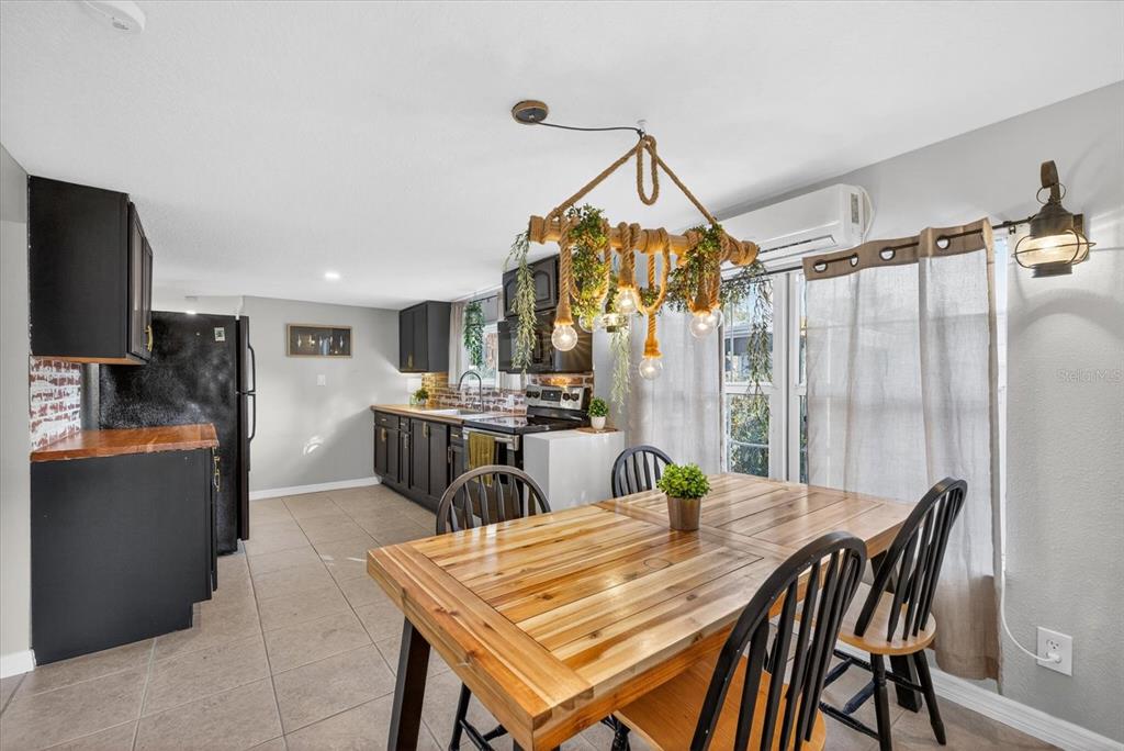 7286 Aberdeen Court Weeki Wachee, FL 34607 - Photo 4 of 37 a dining room with furniture and window