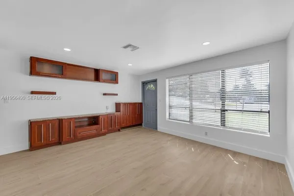 a view of an empty room with a window