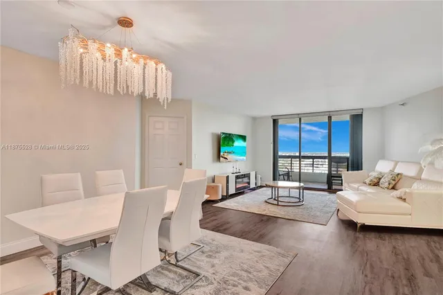 a living room with furniture and a lamp