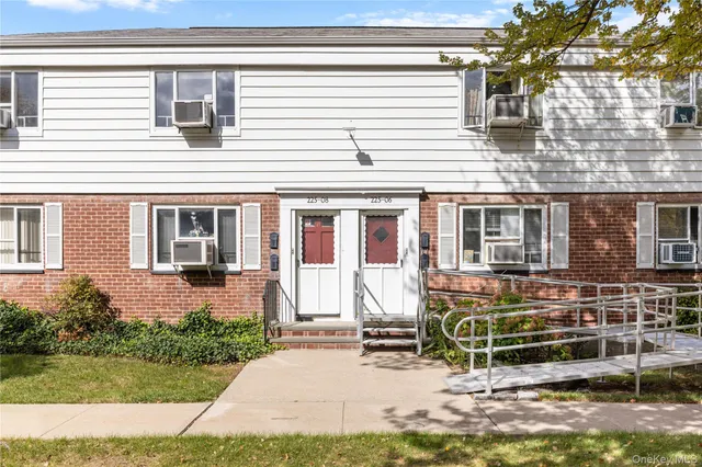 front view of a house with a bench