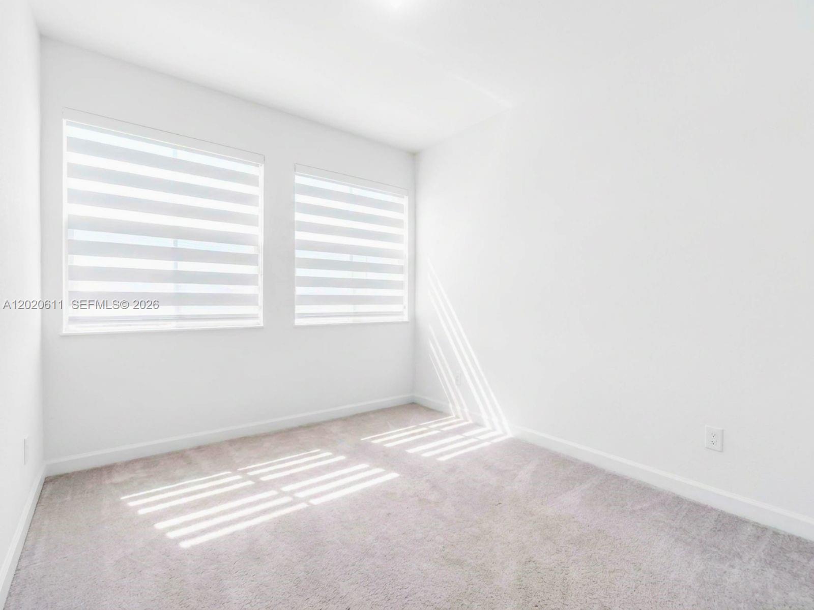 26455 Southwest 148th Avenue Homestead, FL 33032 - Photo 18 of 35 a view of an empty room with a window