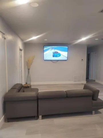 a living room with furniture and a rug