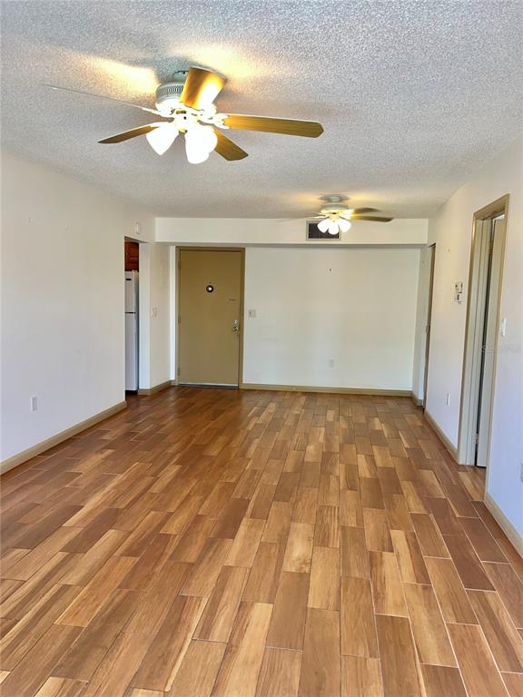 519 Albee Farm Road, Unit 303 Venice, FL 34285 - Photo 13 of 58 wooden floor in an empty room