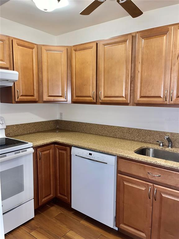 519 Albee Farm Road, Unit 303 Venice, FL 34285 - Photo 15 of 58 a kitchen with a sink and cabinets