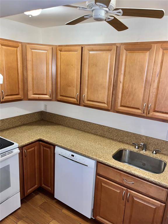 519 Albee Farm Road, Unit 303 Venice, FL 34285 - Photo 17 of 58 a kitchen with a sink and cabinets