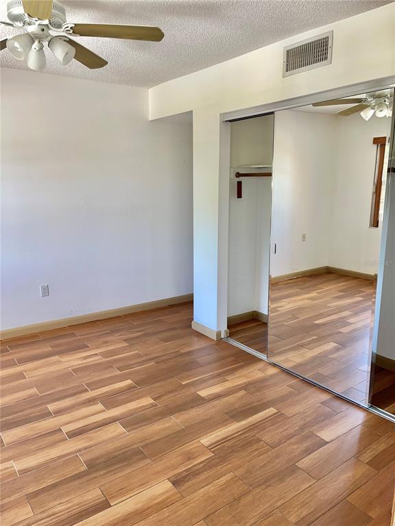 519 Albee Farm Road, Unit 303 Venice, FL 34285 - Photo 24 of 58 a view of an empty room with a ceiling fan and window