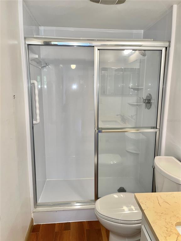 519 Albee Farm Road, Unit 303 Venice, FL 34285 - Photo 25 of 58 a bathroom with a shower a toilet and a sink