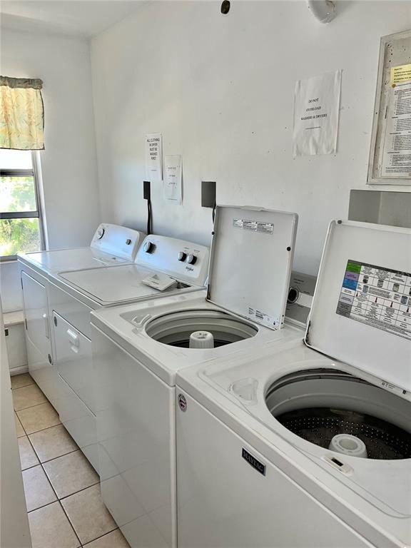 519 Albee Farm Road, Unit 303 Venice, FL 34285 - Photo 28 of 58 a utility room with dryer and washer