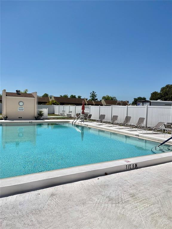 519 Albee Farm Road, Unit 303 Venice, FL 34285 - Photo 30 of 58 a view of a house with a yard