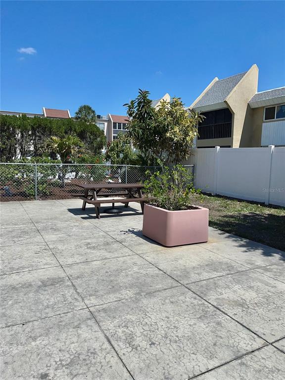 519 Albee Farm Road, Unit 303 Venice, FL 34285 - Photo 32 of 58 a view of a terrace with chairs