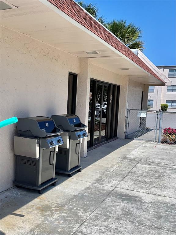 519 Albee Farm Road, Unit 303 Venice, FL 34285 - Photo 33 of 58 a kitchen with stainless steel appliances kitchen island granite countertop a stove and a refrigerator