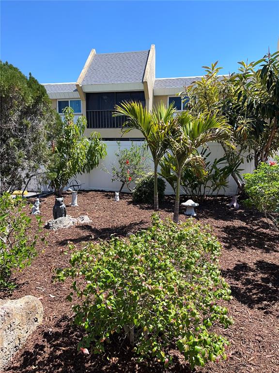 519 Albee Farm Road, Unit 303 Venice, FL 34285 - Photo 35 of 58 a view of a house with a yard