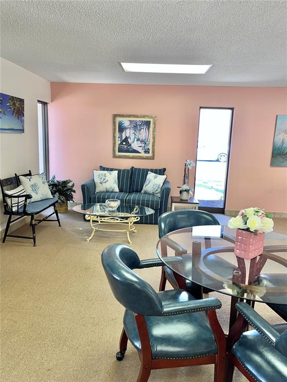 519 Albee Farm Road, Unit 303 Venice, FL 34285 - Photo 37 of 58 a living room with furniture and wooden floor