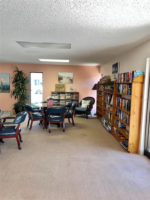 519 Albee Farm Road, Unit 303 Venice, FL 34285 - Photo 38 of 58 a living room with furniture and a large window