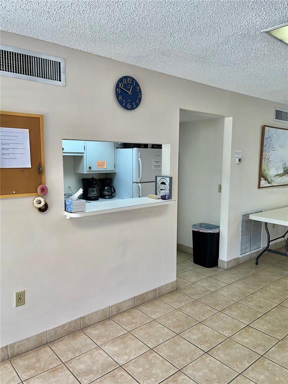 519 Albee Farm Road, Unit 303 Venice, FL 34285 - Photo 41 of 58 a view of kitchen with stainless steel appliances a refrigerator and a stove